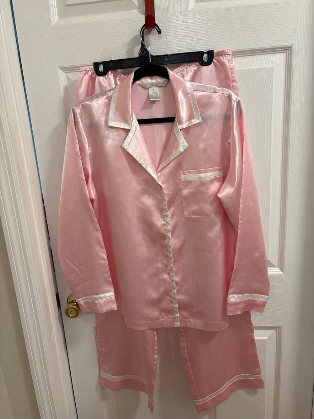 pink August Silk button-down pajamas with white contrast piping.